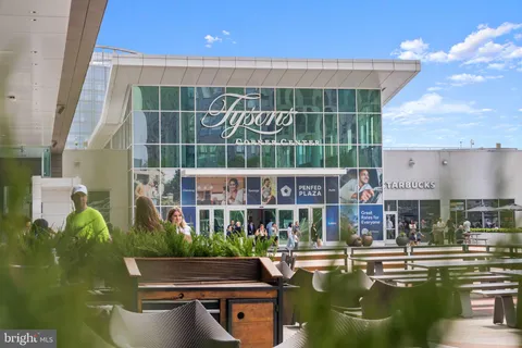 a view of the patio with table and chairs