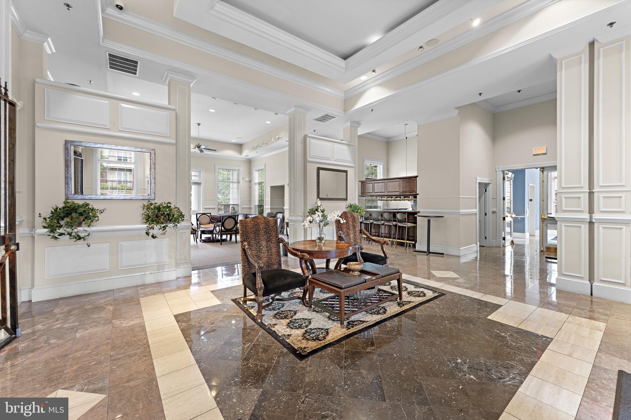 1591 Spring Gate Dr., Unit 3314 McLean, VA 22102 - Photo 50 of 56 a living room with furniture and a table