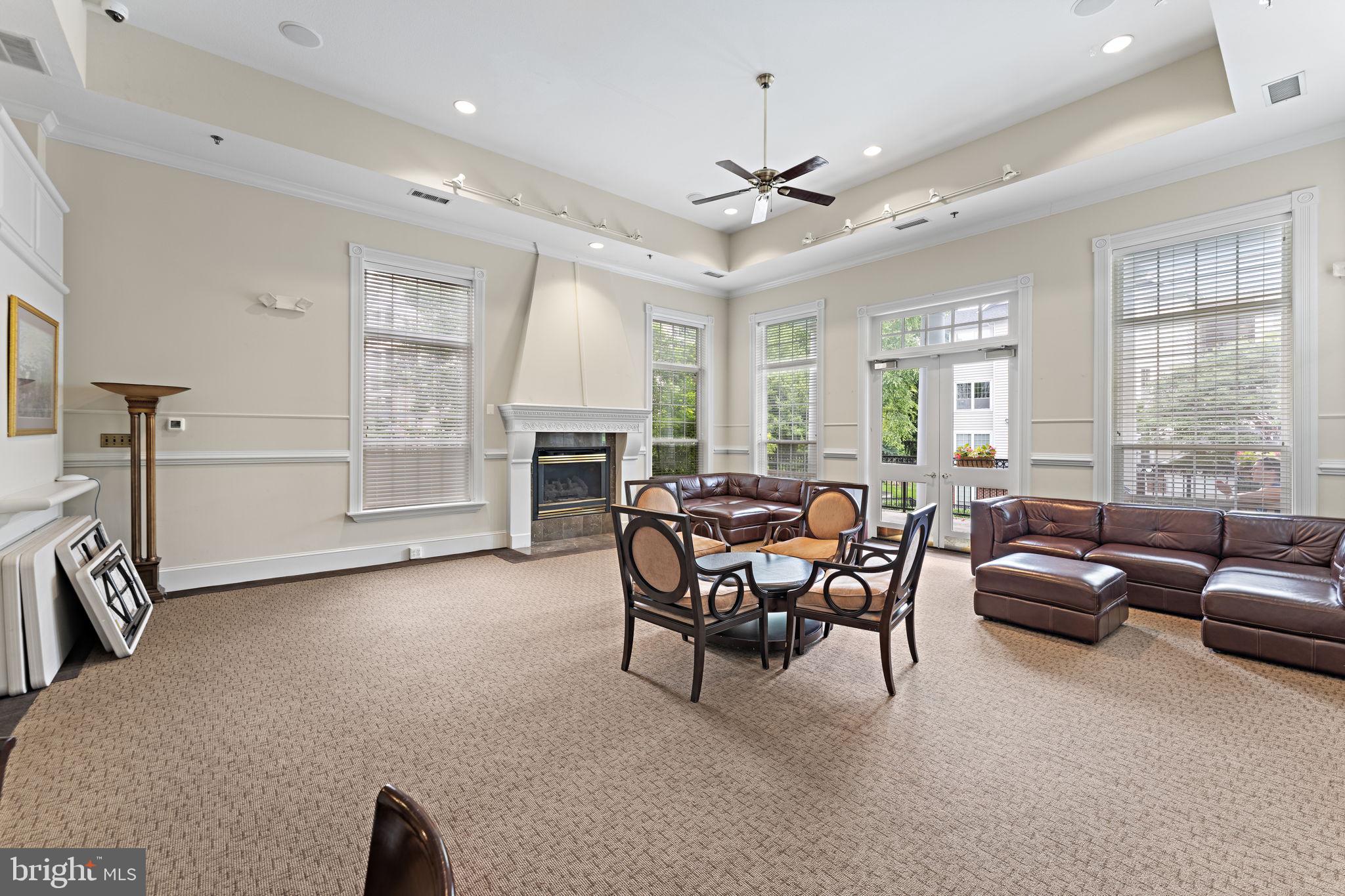 1591 Spring Gate Dr., Unit 3314 McLean, VA 22102 - Photo 51 of 56 a living room with furniture and a fireplace