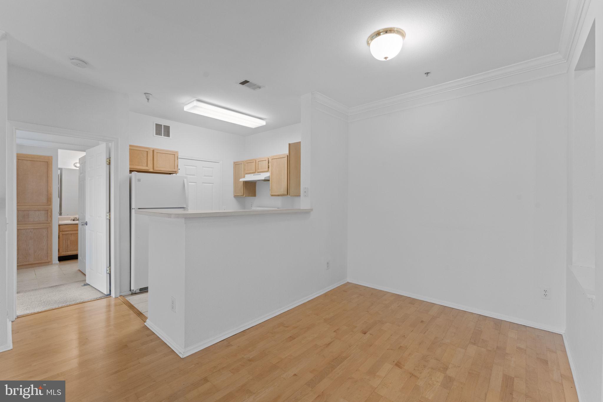 1591 Spring Gate Dr., Unit 3314 McLean, VA 22102 - Photo 9 of 56 wooden floor in an empty room