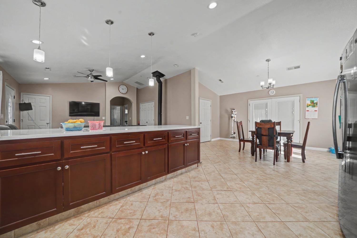 12900 New York Ranch Road Jackson, CA 95642 - Photo 11 of 31 a kitchen with a sink and chairs