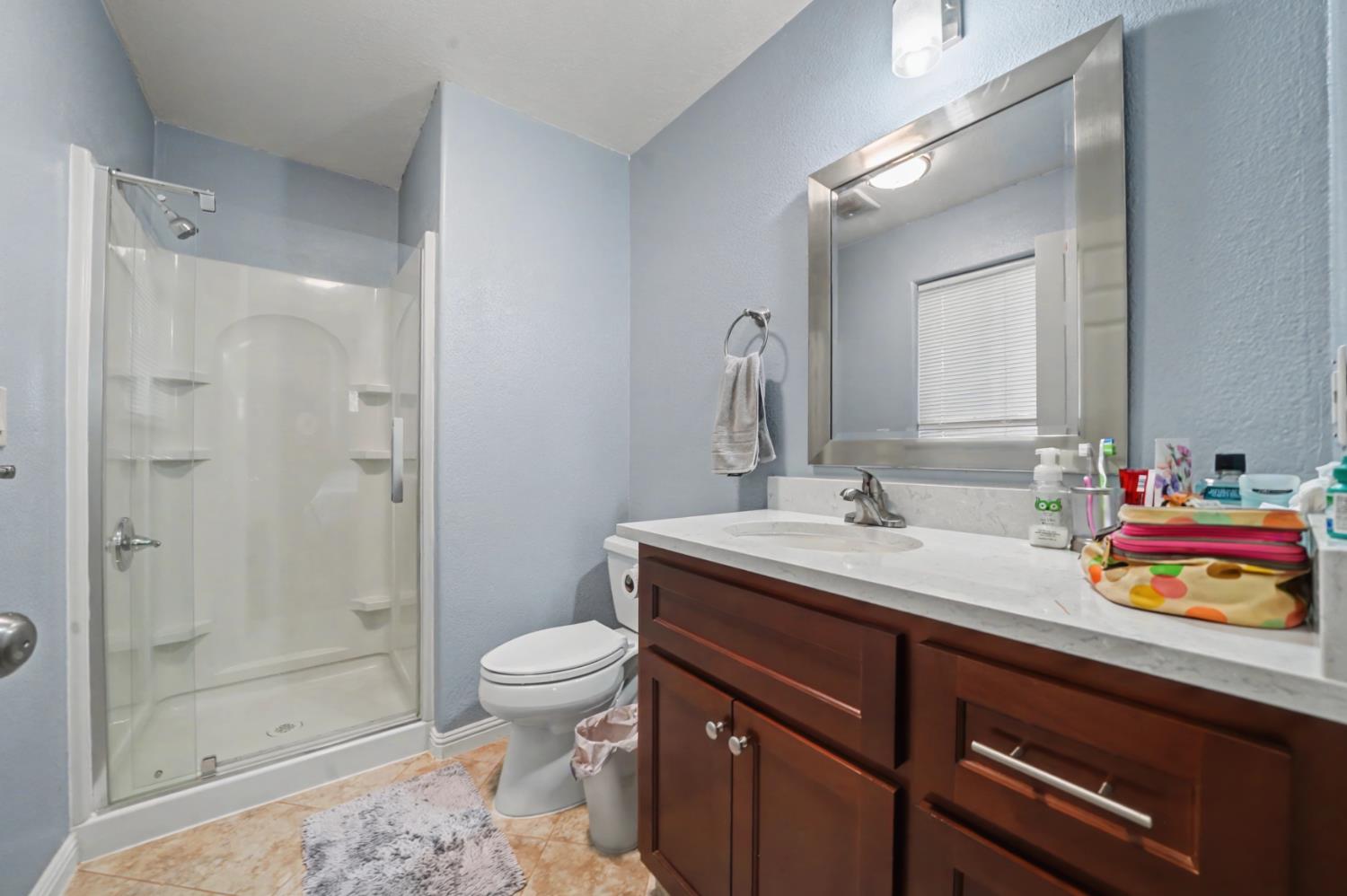 12900 New York Ranch Road Jackson, CA 95642 - Photo 14 of 31 a bathroom with a sink a toilet and shower