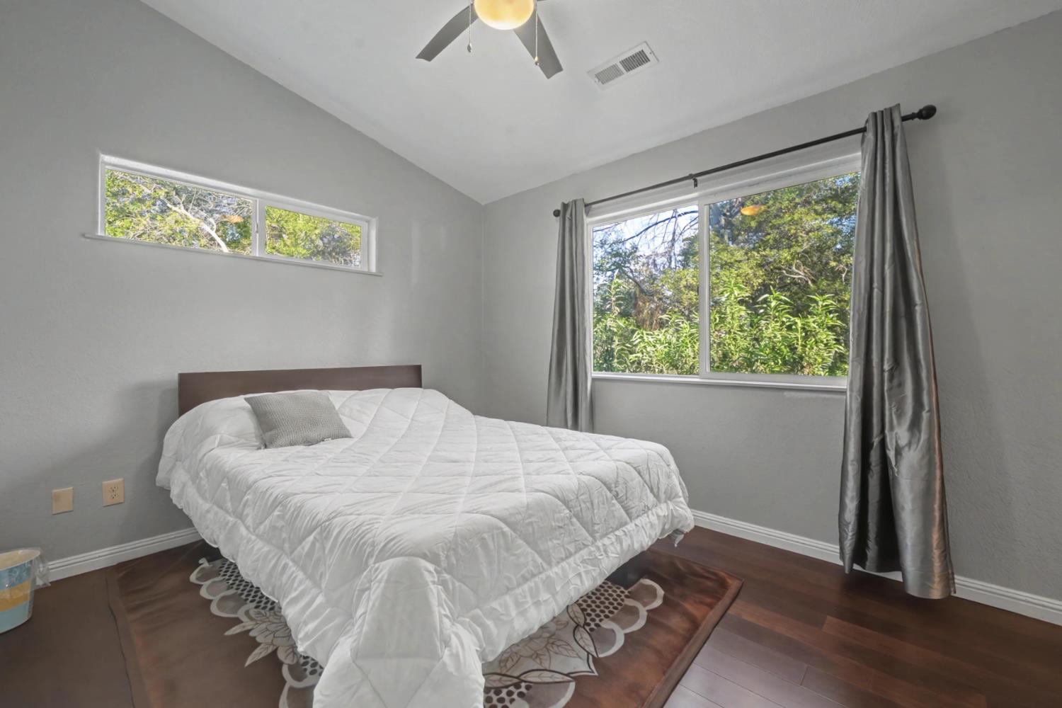 12900 New York Ranch Road Jackson, CA 95642 - Photo 15 of 31 a large bed sitting in a bedroom next to a window