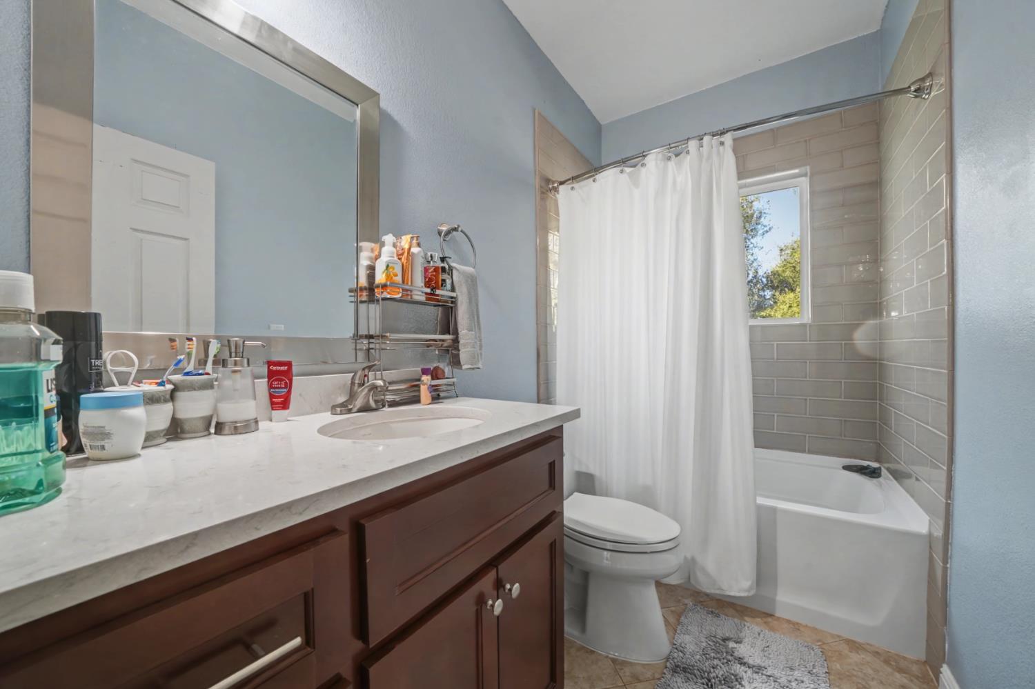 12900 New York Ranch Road Jackson, CA 95642 - Photo 17 of 31 a bathroom with a sink a toilet and shower