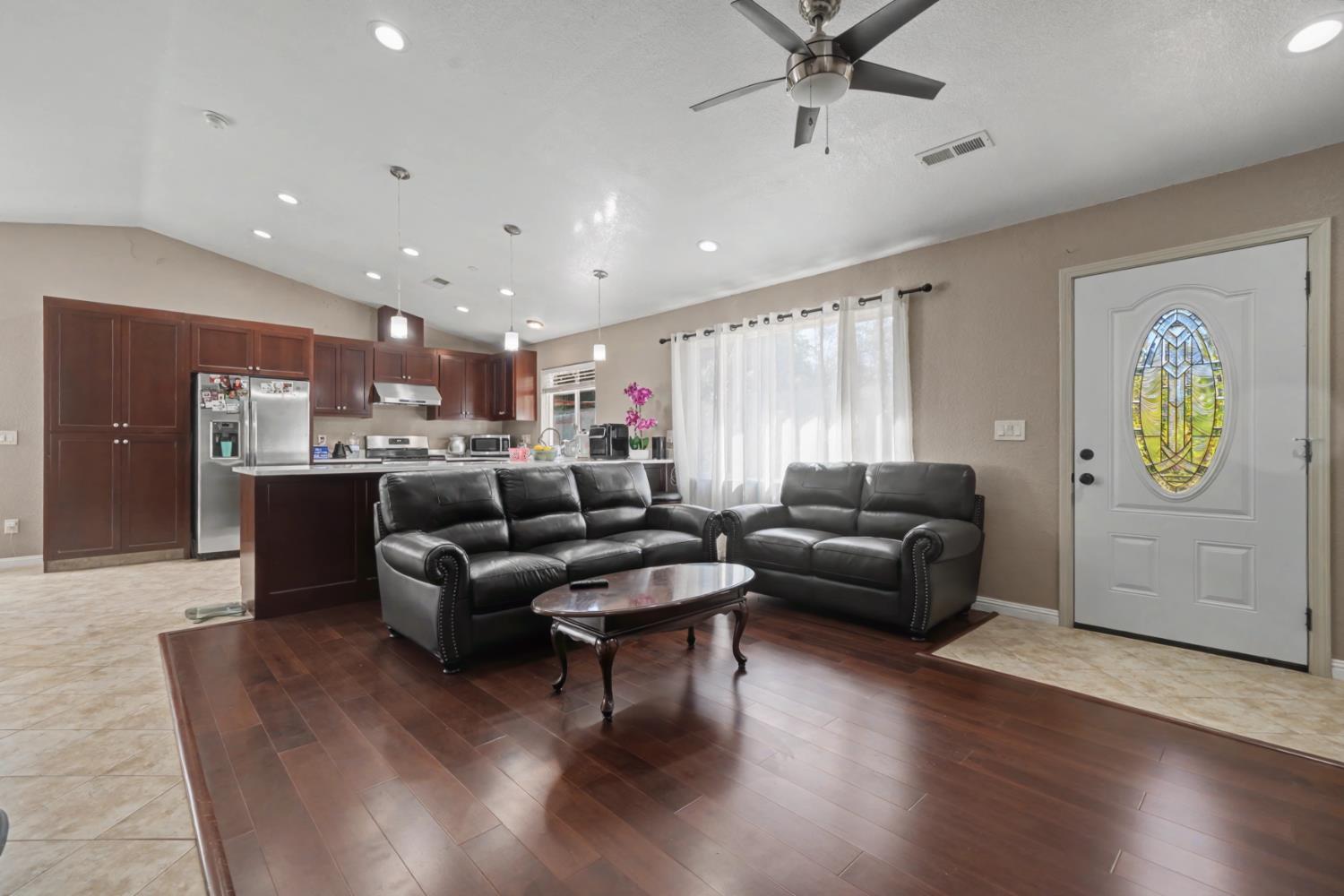 12900 New York Ranch Road Jackson, CA 95642 - Photo 8 of 31 a living room with furniture and a wooden floor