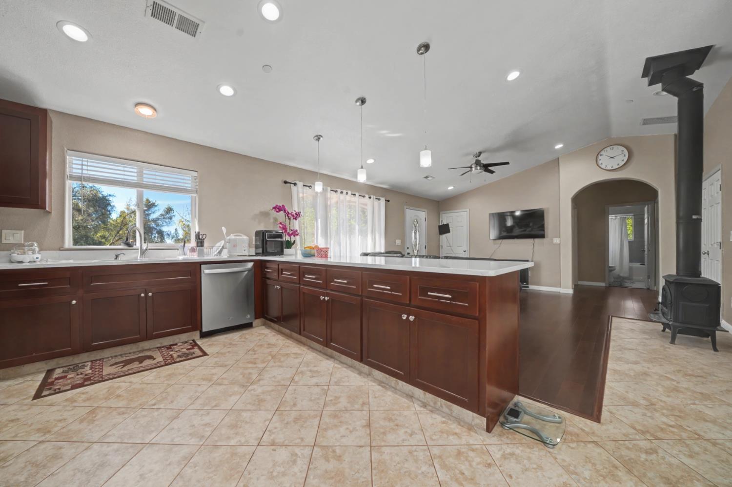 12900 New York Ranch Road Jackson, CA 95642 - Photo 9 of 31 a kitchen with stainless steel appliances granite countertop a refrigerator and a sink