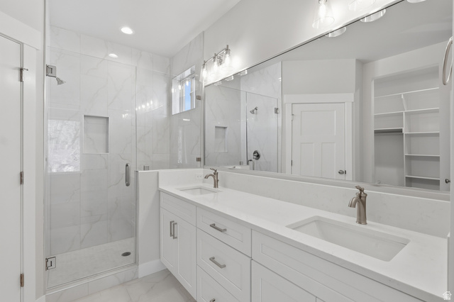677 East 800 S Street Springville, UT 84663 - Photo 20 of 35 Bathroom with double vanity, a marble finish shower, a spacious closet, light marble finish floors, and recessed lighting