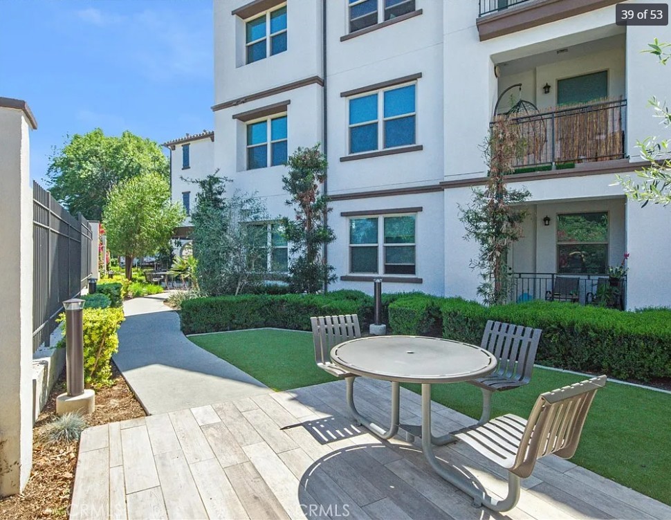 8016 Santa Fe Springs Road Whittier, CA 90602 - Photo 11 of 34 a view of a table and chairs in the patio with a fire pit