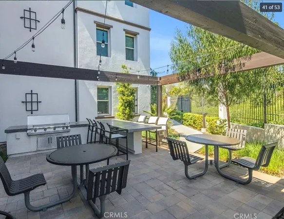 a view of a patio with a table and chairs