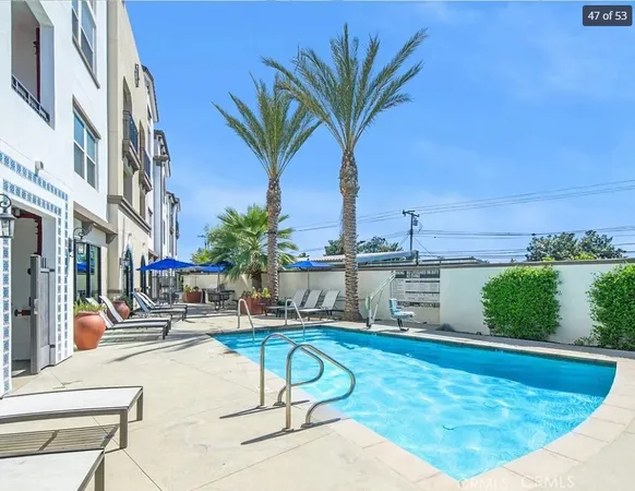 a swimming pool with outdoor seating and yard