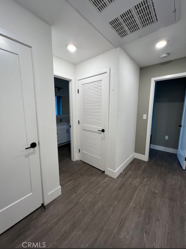 8016 Santa Fe Springs Road Whittier, CA 90602 - Photo 24 of 34 an empty room with wooden floor and closet