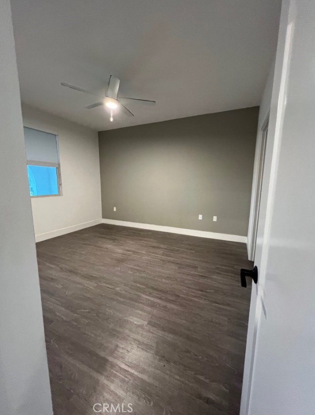 8016 Santa Fe Springs Road Whittier, CA 90602 - Photo 29 of 34 an empty room with wooden floor and windows