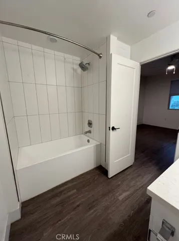 a bathroom with a bathtub and shower