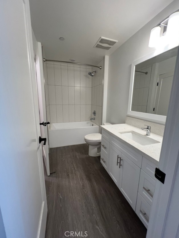 8016 Santa Fe Springs Road Whittier, CA 90602 - Photo 33 of 34 a bathroom with a double vanity sink toilet mirror and bathtub