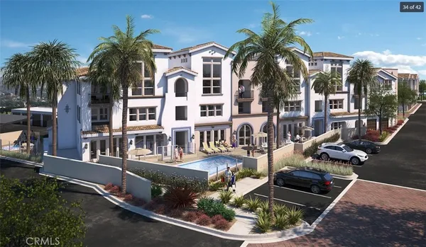 a front view of multiple houses with yard