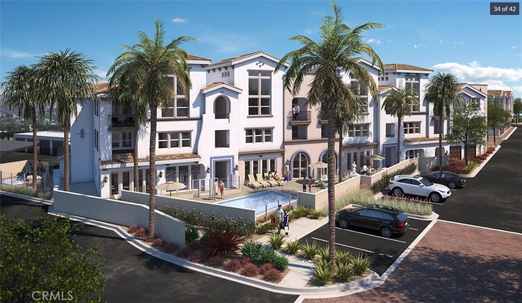 8016 Santa Fe Springs Road Whittier, CA 90602 - Photo 5 of 34 a front view of multiple houses with yard