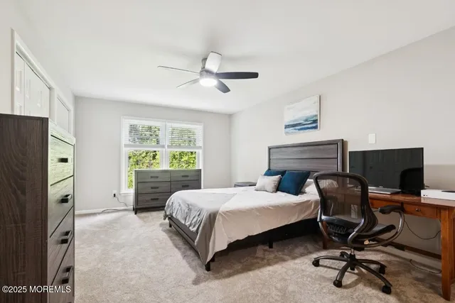 a bedroom with a bed and a chair