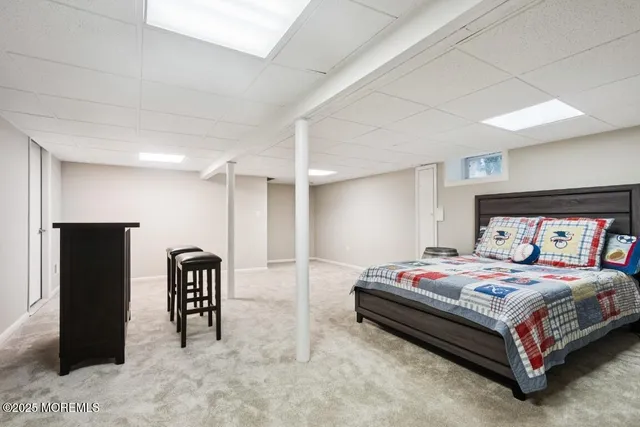 a bedroom with a bed and a table