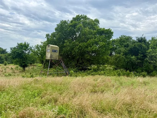 a view of kitchen island with a sink and wooden floor