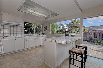 332 Pompano Circle Foster City, CA 94404 - Photo 7 of 17 a kitchen with sink cabinets and window