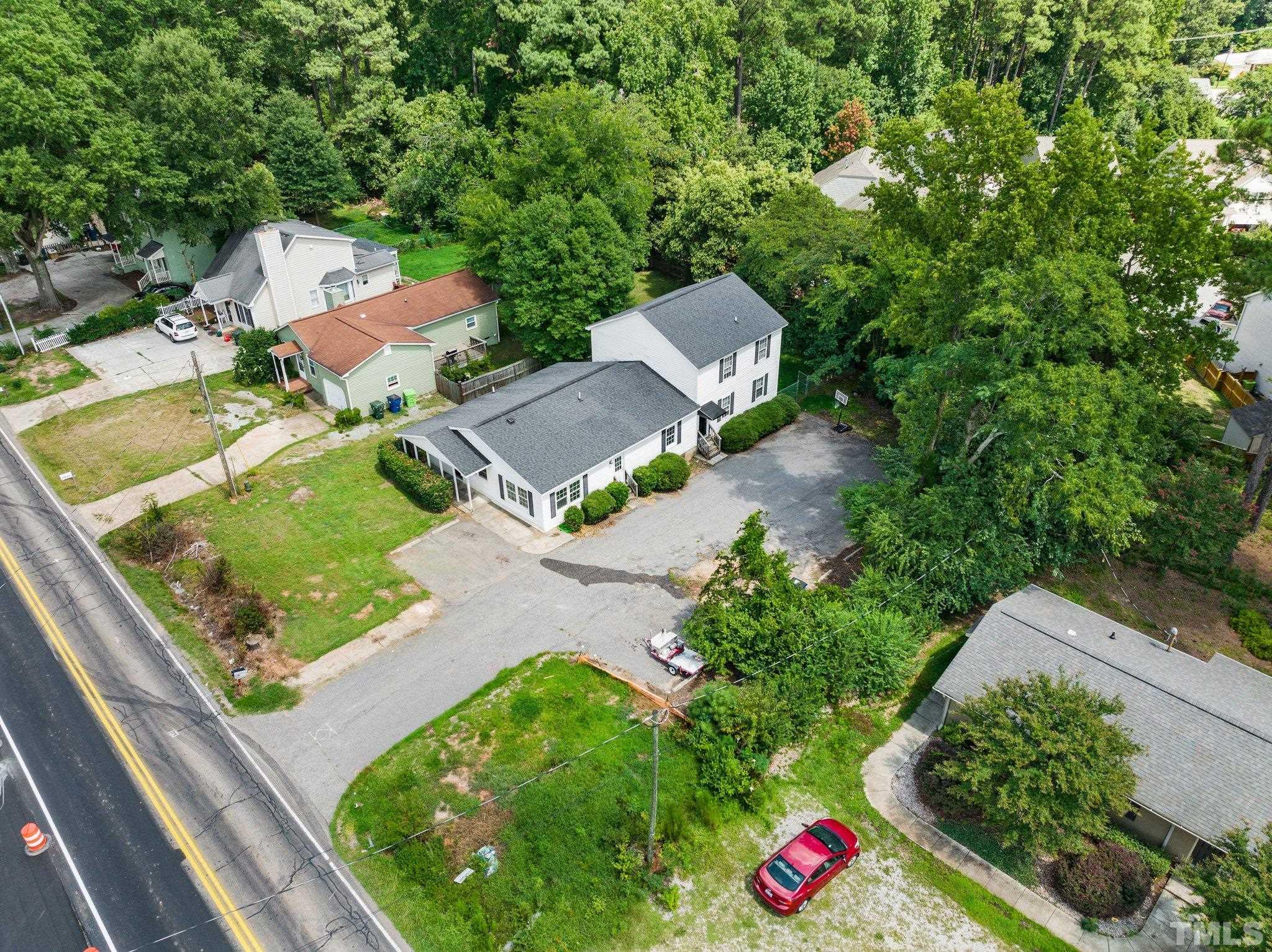 405 Jones Franklin Road Raleigh, NC 27606 - Photo 1 of 41 an aerial view of residential houses with outdoor space