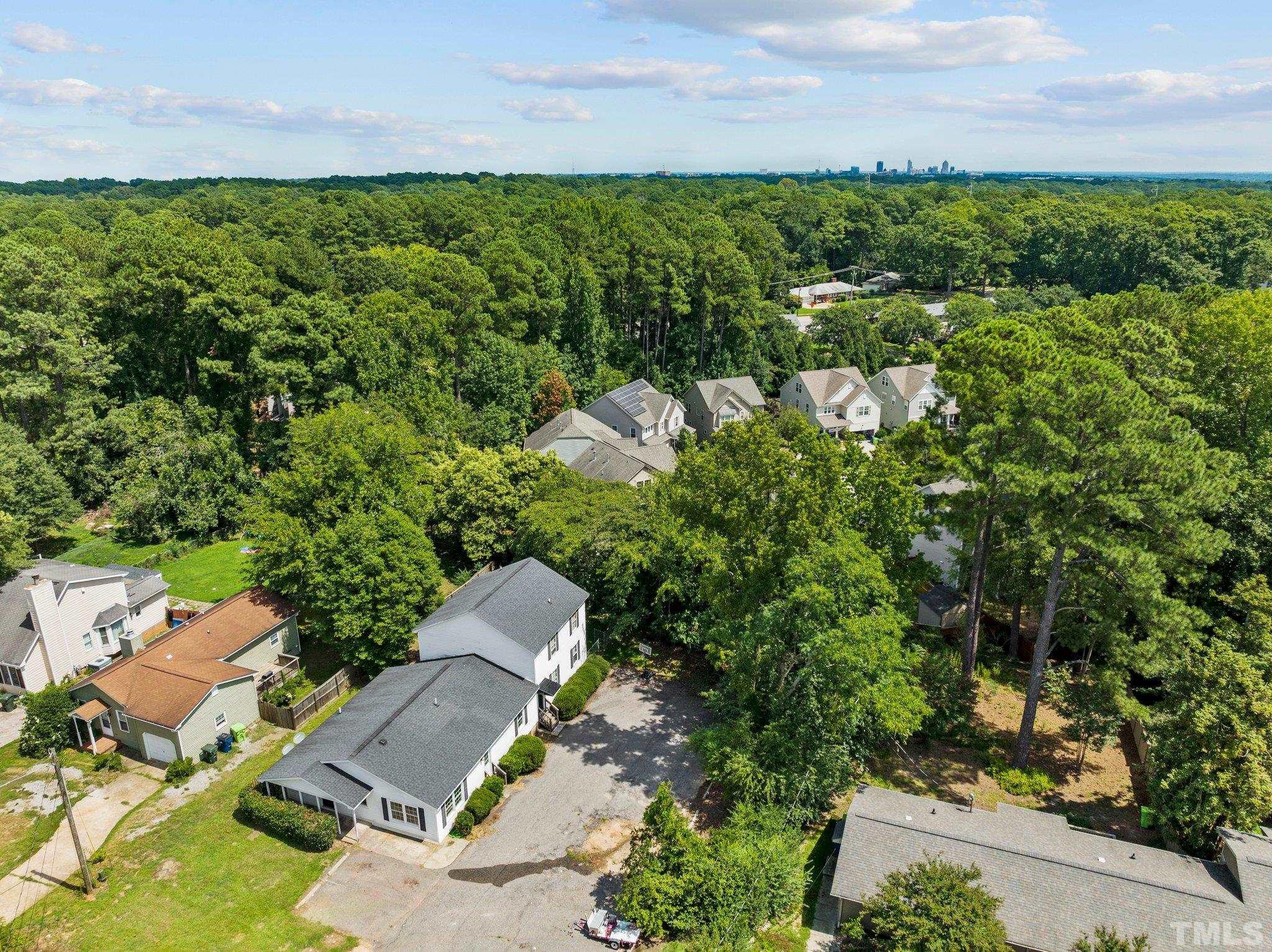 405 Jones Franklin Road Raleigh, NC 27606 - Photo 2 of 41 an aerial view of a house with a yard