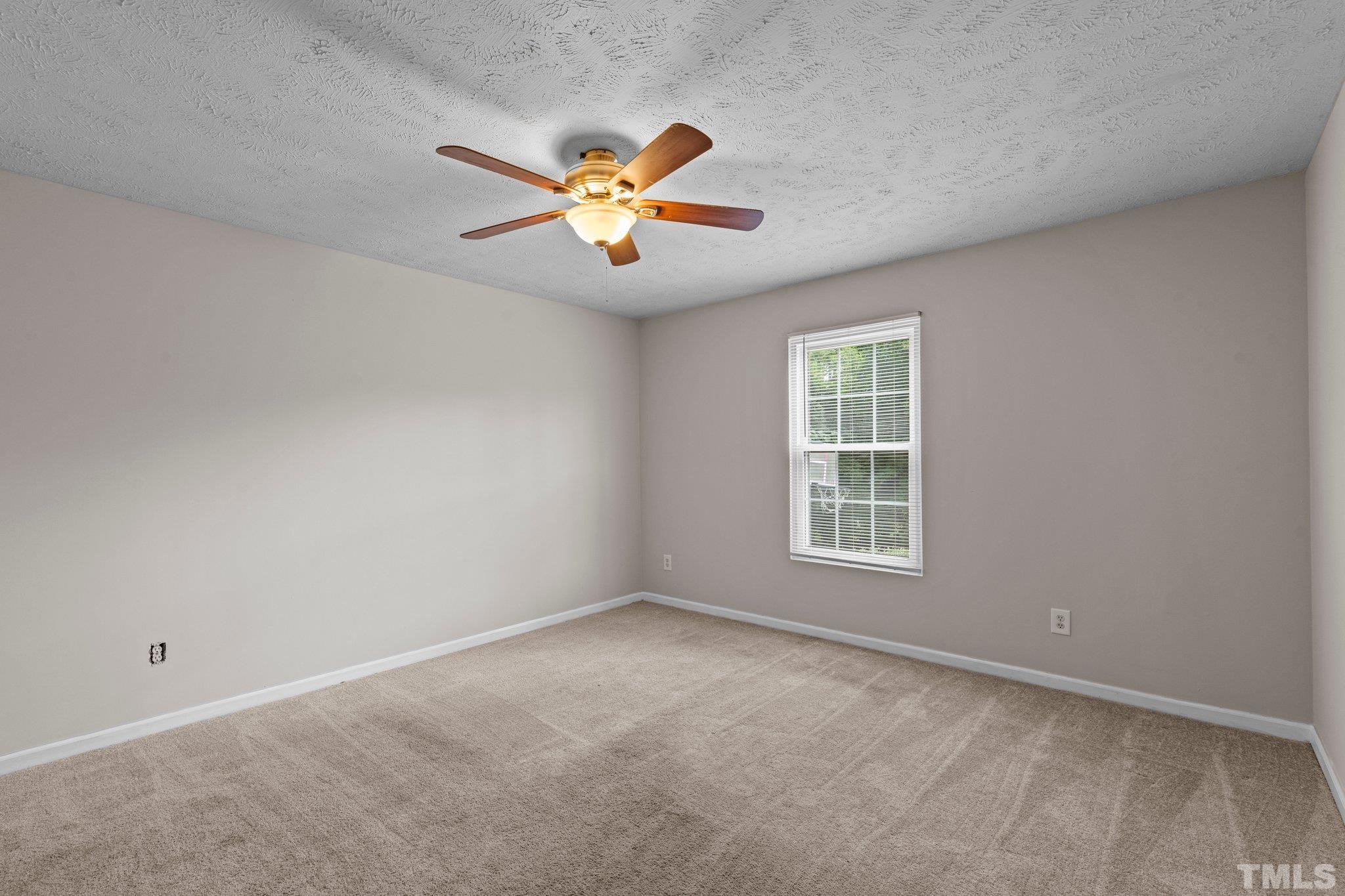 405 Jones Franklin Road Raleigh, NC 27606 - Photo 24 of 41 a view of an empty room with a window