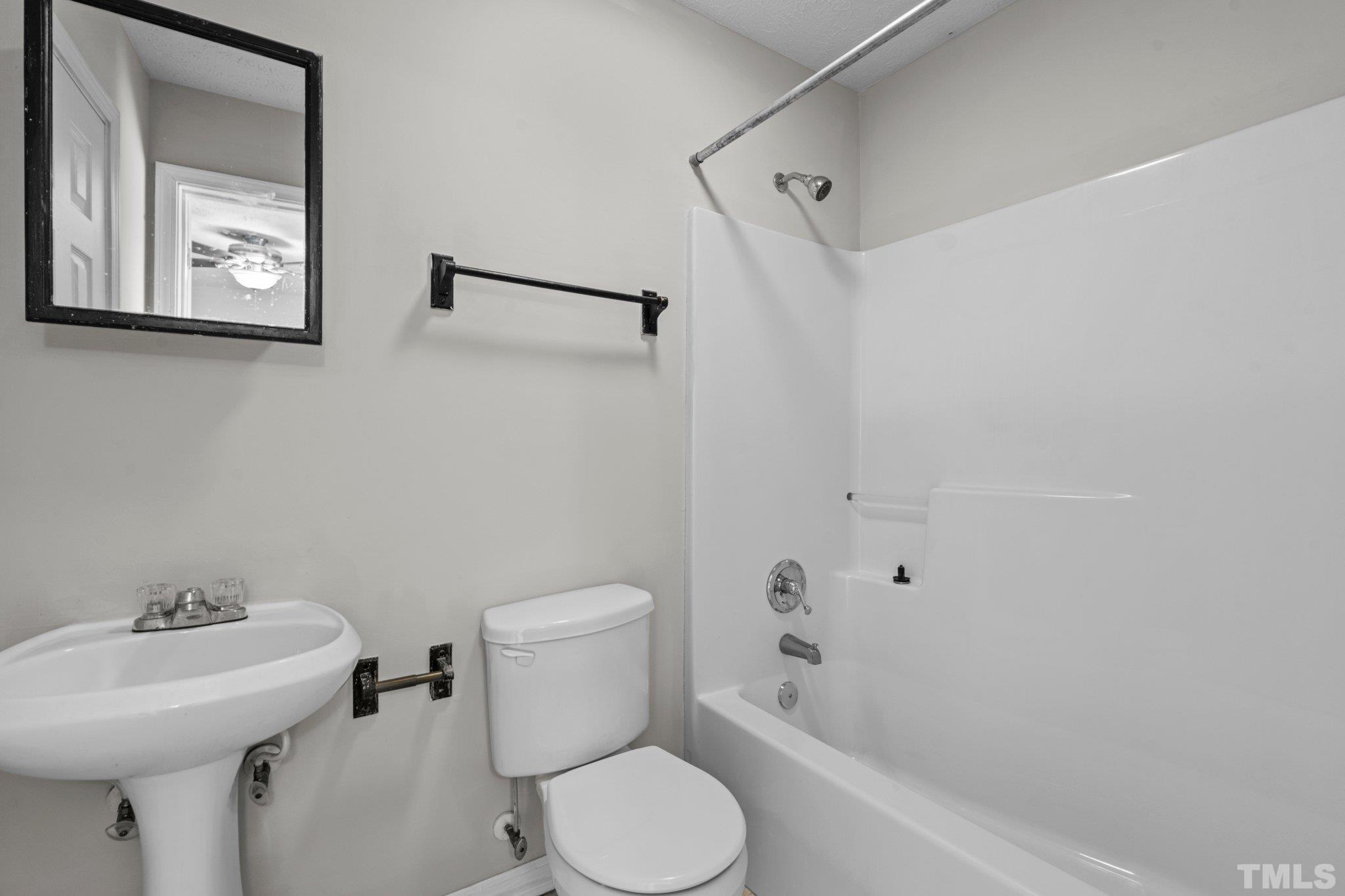 405 Jones Franklin Road Raleigh, NC 27606 - Photo 34 of 41 a bathroom with a sink toilet and shower