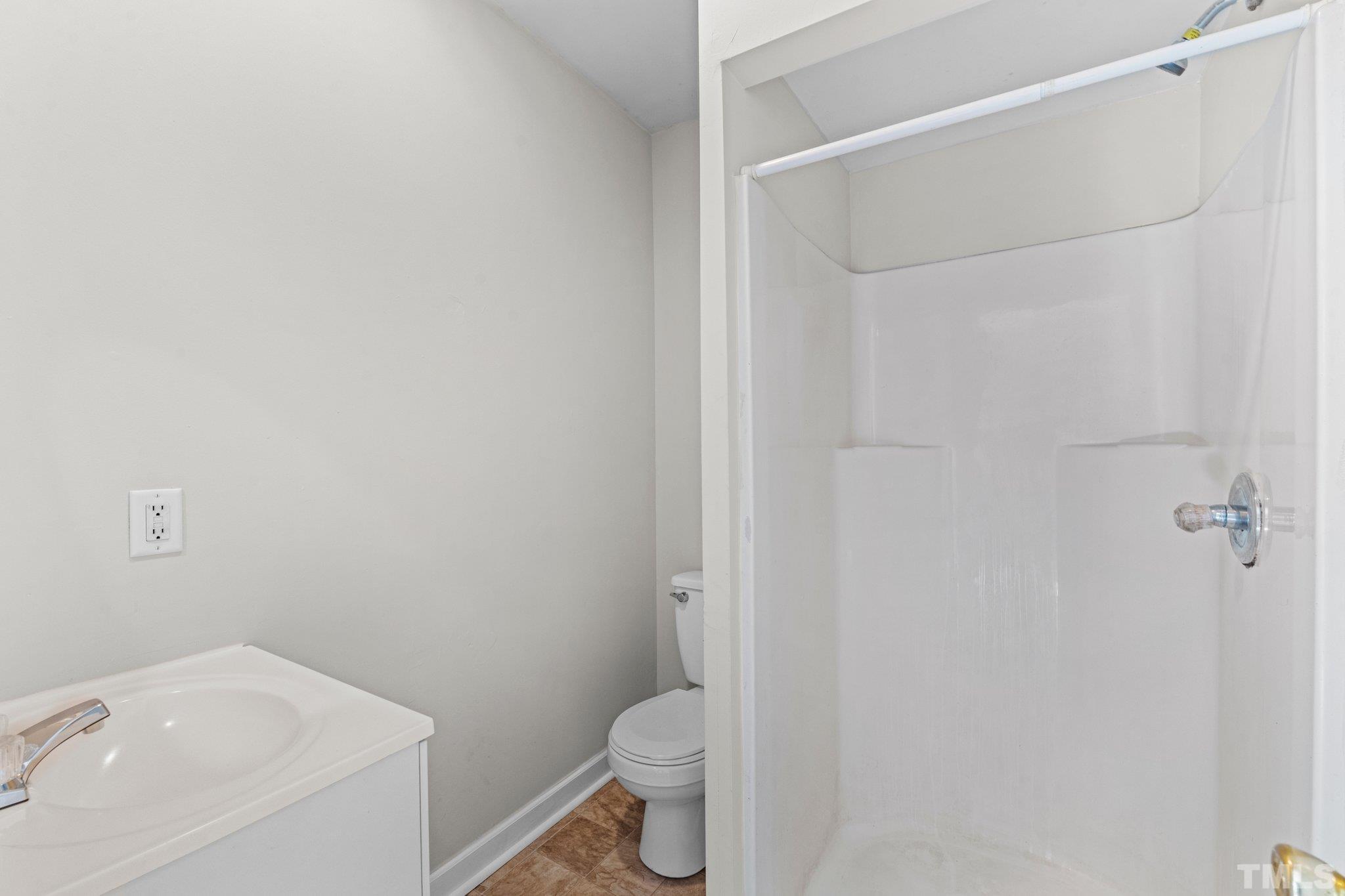 405 Jones Franklin Road Raleigh, NC 27606 - Photo 7 of 41 a bathroom with a sink and toilet