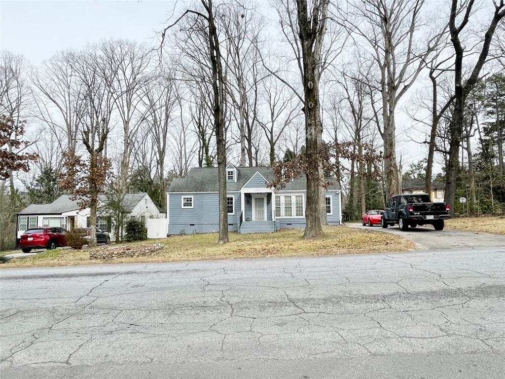 2365 Ben Hill Road East Point, GA 30344 - Photo 1 of 1 a view of street with parked cars