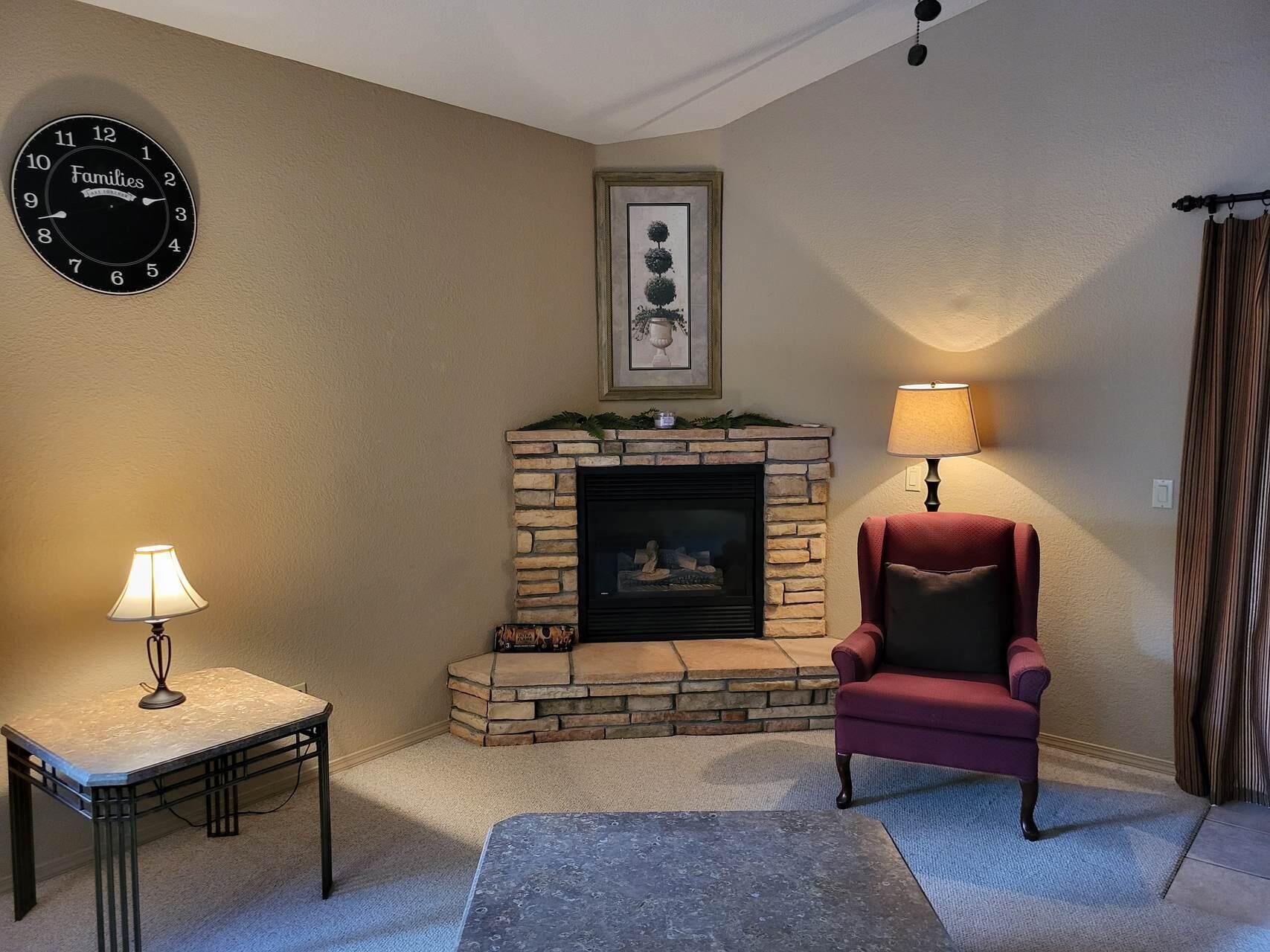 1120 South Sycamore Circle Payson, AZ 85541 - Photo 12 of 44 a living room with furniture and a fireplace