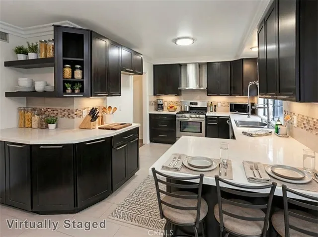 a kitchen with a dining table and chairs