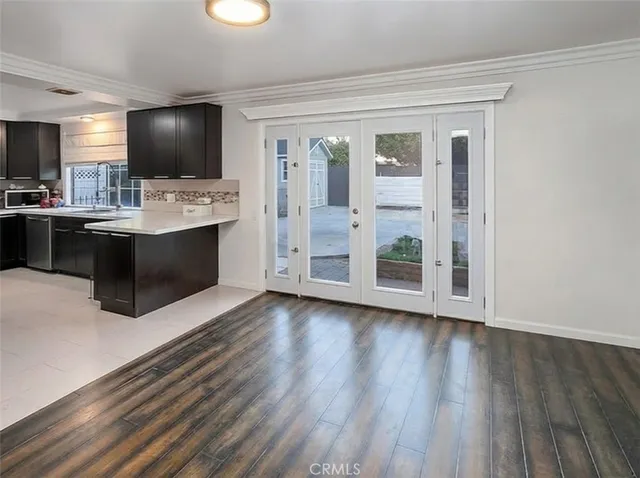 a view of kitchen with sink microwave and stove