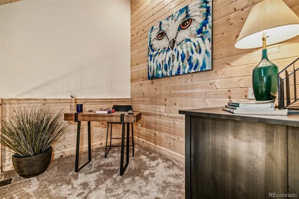a view of a patio with a table and chairs