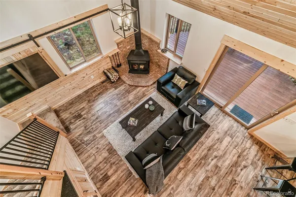 a view of a living room with wooden floor