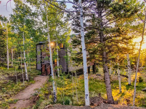 a aerial view of a house with a yard