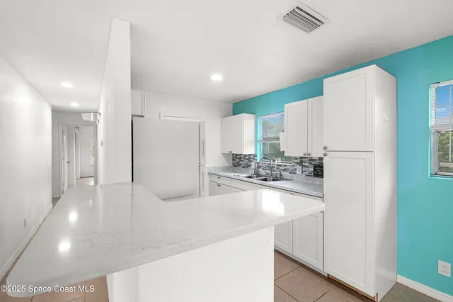 a bathroom with a sink and a shower