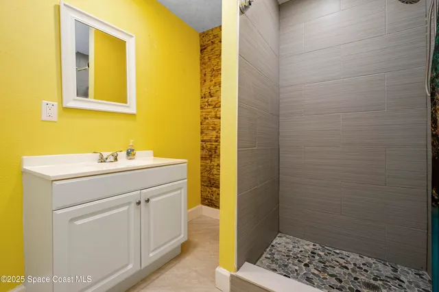 a view of a balcony with wooden floor and fence