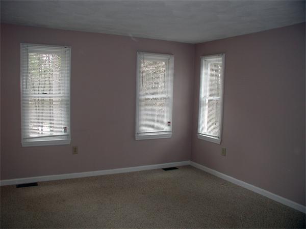 44 Lawton Road, Unit A Shirley, MA 01464 - Photo 5 of 12 an empty room with windows