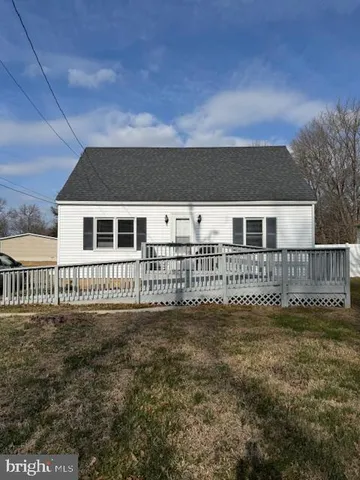 a view of a house with a small yard