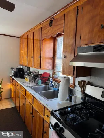 a kitchen with a stove and a sink
