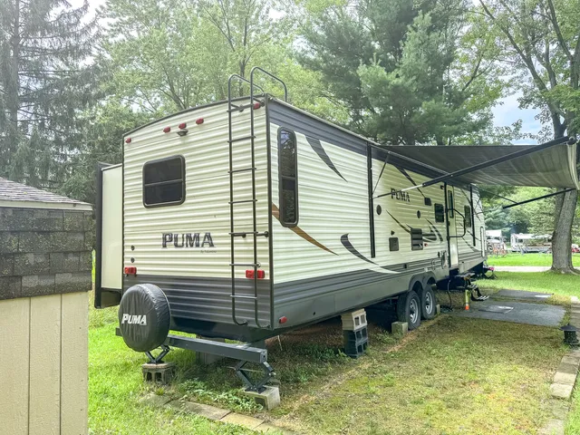 a backyard of a house with outdoor seating