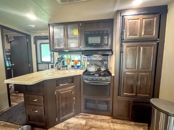 a kitchen with a refrigerator and a sink