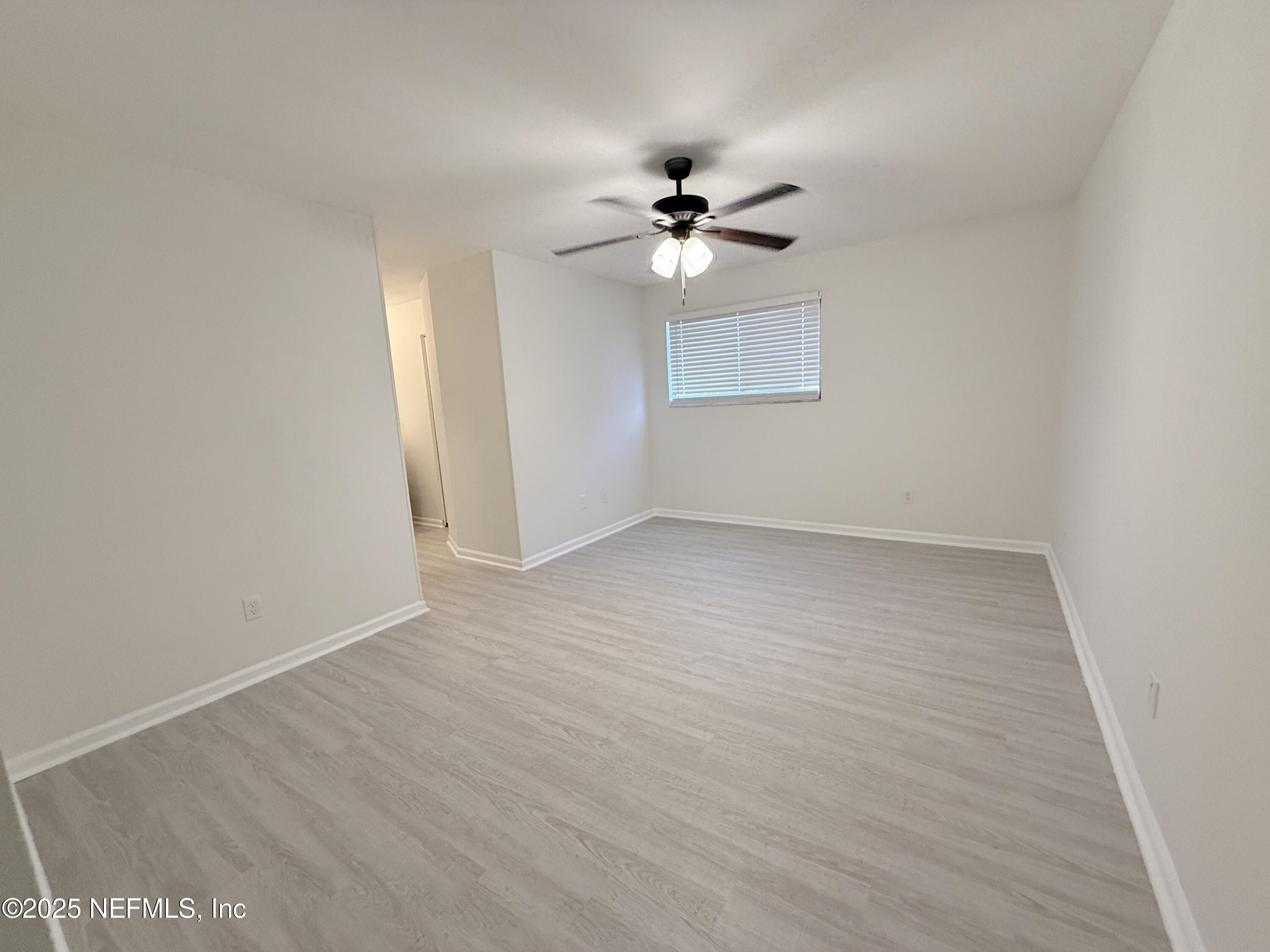 3801 Crown Point Road, Unit 2061 Jacksonville, FL 32257 - Photo 11 of 20 a view of empty room with wooden floor