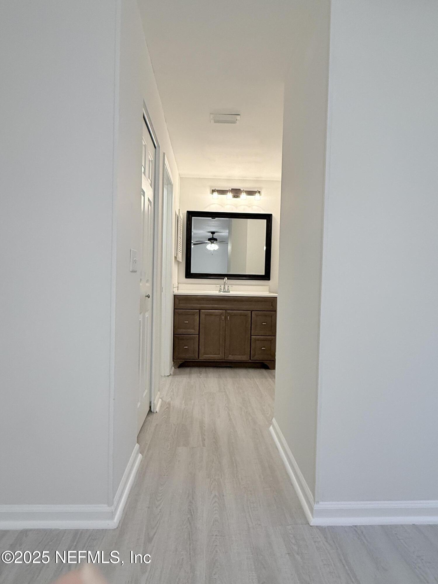 3801 Crown Point Road, Unit 2061 Jacksonville, FL 32257 - Photo 12 of 20 a view of a hallway with wooden floor