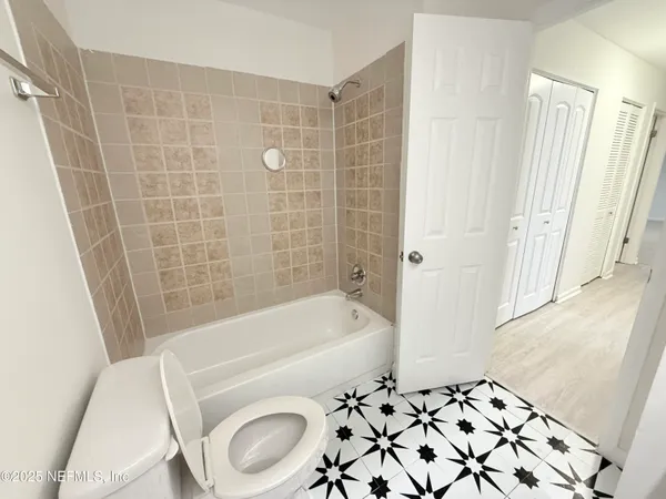 a bathroom with a sink a toilet and a bathtub