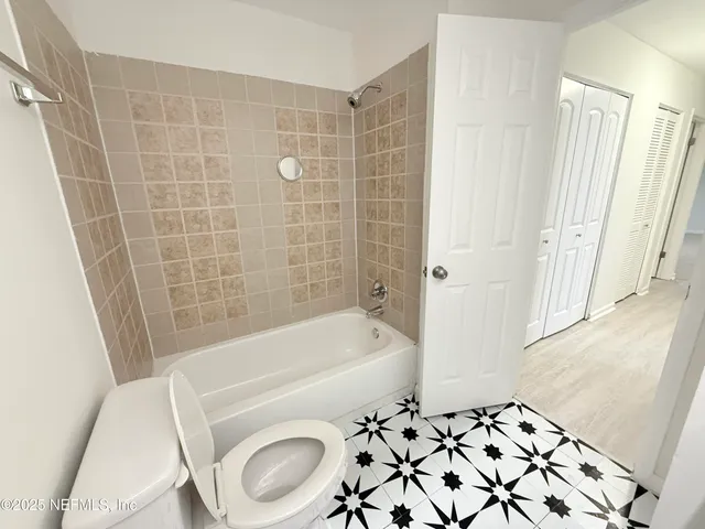 a bathroom with a sink a toilet and a bathtub