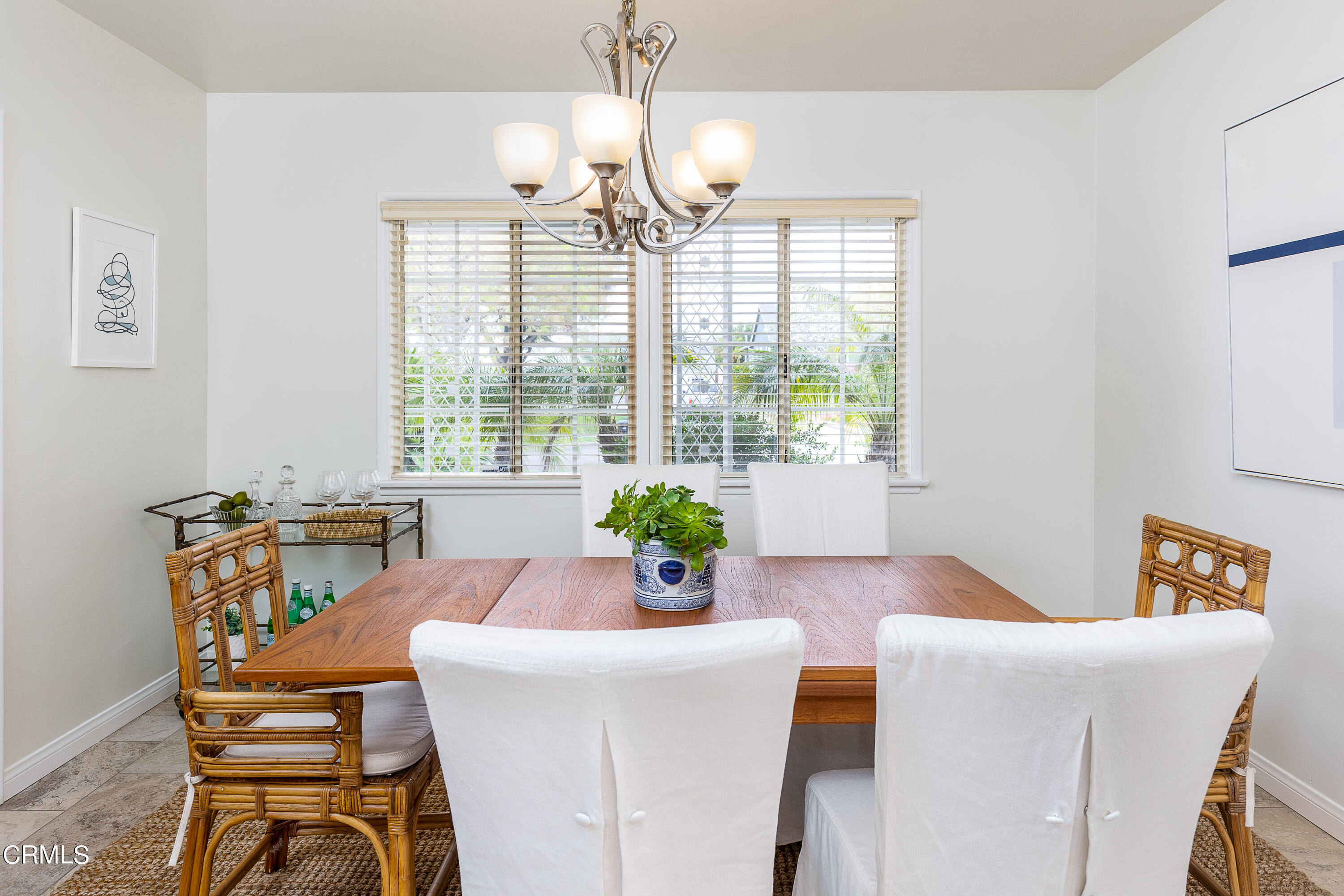 636 Birmingham Road Burbank, CA 91504 - Photo 11 of 25 a view of a dining room with furniture a chandelier and wooden floor