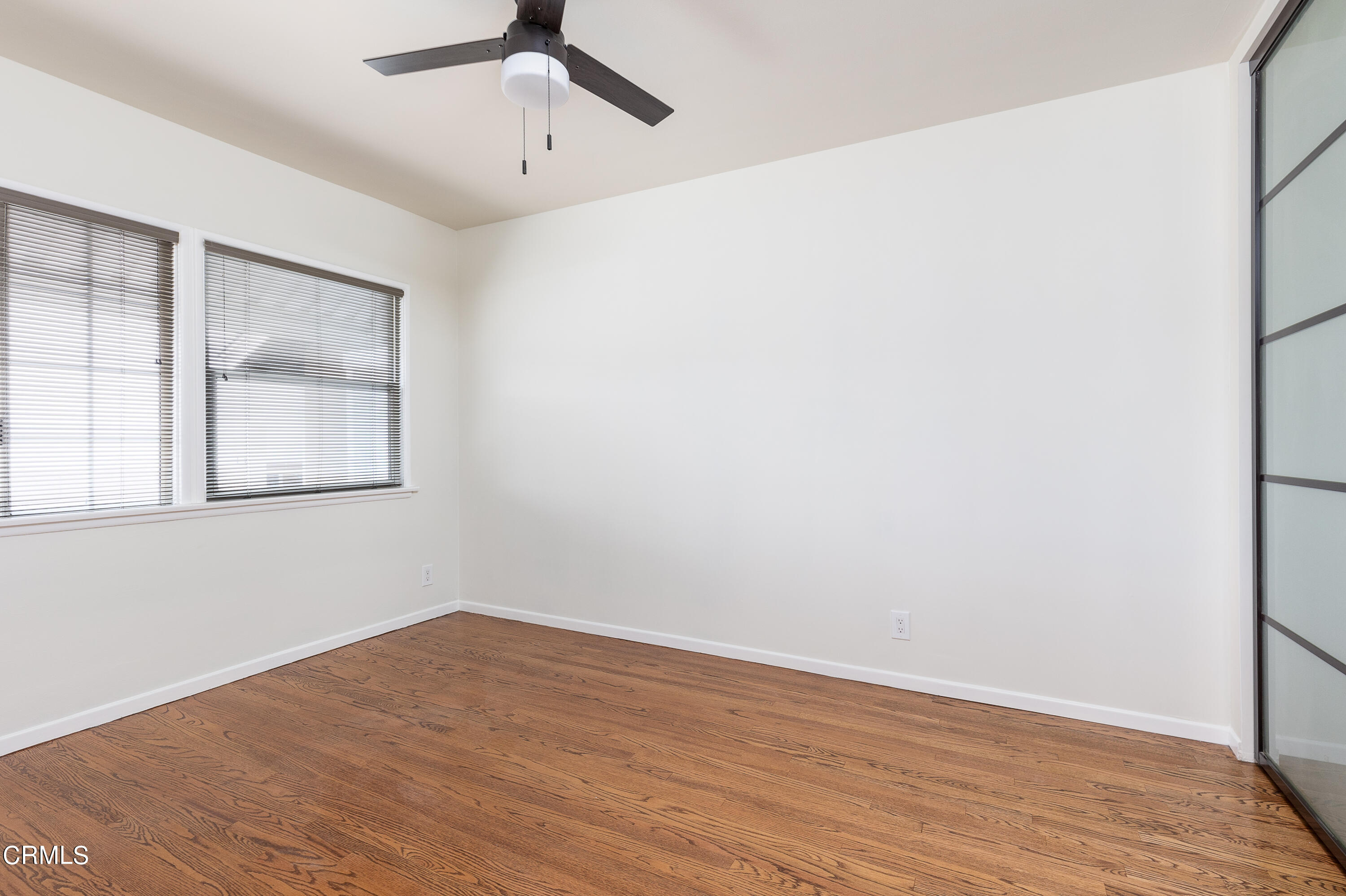 636 Birmingham Road Burbank, CA 91504 - Photo 18 of 25 a view of empty room with wooden floor and fan