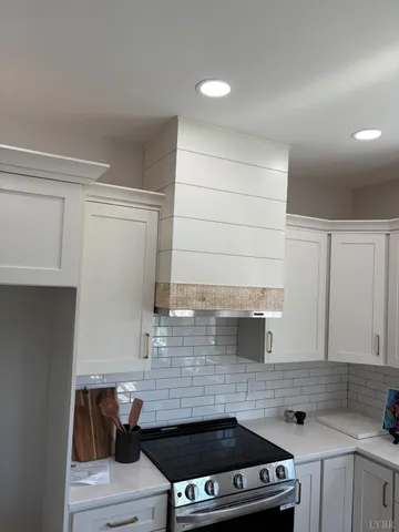 a kitchen with a stove and a sink